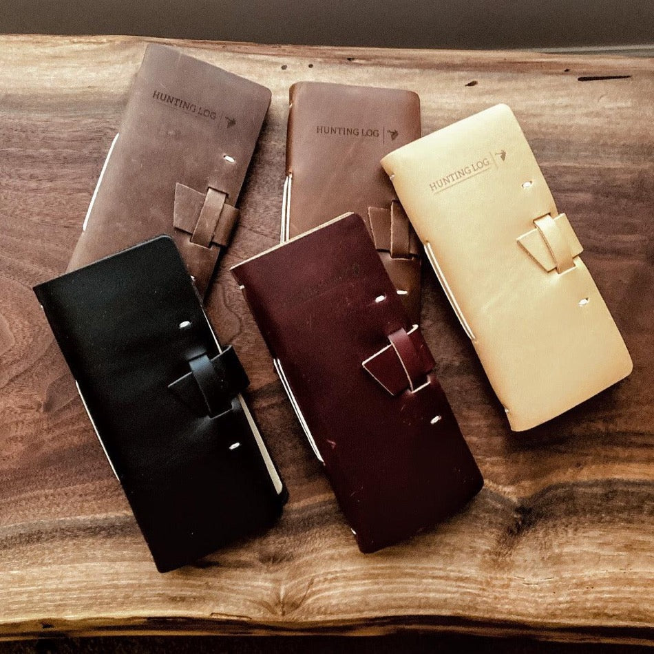 
                  
                    Leather Hunting Journal -Early season or better yet preseason or scouting, our Leather Hunting Journal is a great tool for keeping up with key observations, weather conditions, morning or evening and most importantly, your first hunt with your son or daughter.  Designed to be used on any type of hunt, this leather journal is a outdoors enthusiast partner, soon to be filled with memories of a lifetime.   3.75" x 1" x 8" Includes 96 printed rough-cut cream-colored pages
                  
                