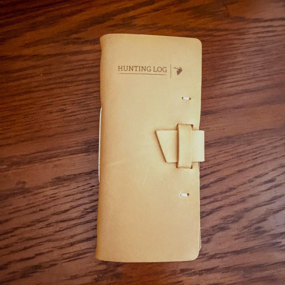 
                  
                    Leather Hunting Journal - Early season or better yet preseason or scouting, our Leather Hunting Journal is a great tool for keeping up with key observations, weather conditions, morning or evening and most importantly, your first hunt with your son or daughter.  Designed to be used on any type of hunt, this leather journal is a outdoors enthusiast partner, soon to be filled with memories of a lifetime.   3.75" x 1" x 8" Includes 96 printed rough-cut cream-colored pages
                  
                