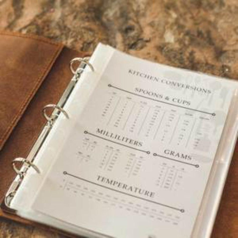 
                  
                    Leather Recipe Binder  This Leather Recipe Binder is a classic way to store all your cherished recipes! Choose from two sizes and get your collection going with plastic page protectors, plus blank 4x6 recipe cards. Keep adding to it for years to come and your recipe book will only get better! It sounds tasty!
                  
                