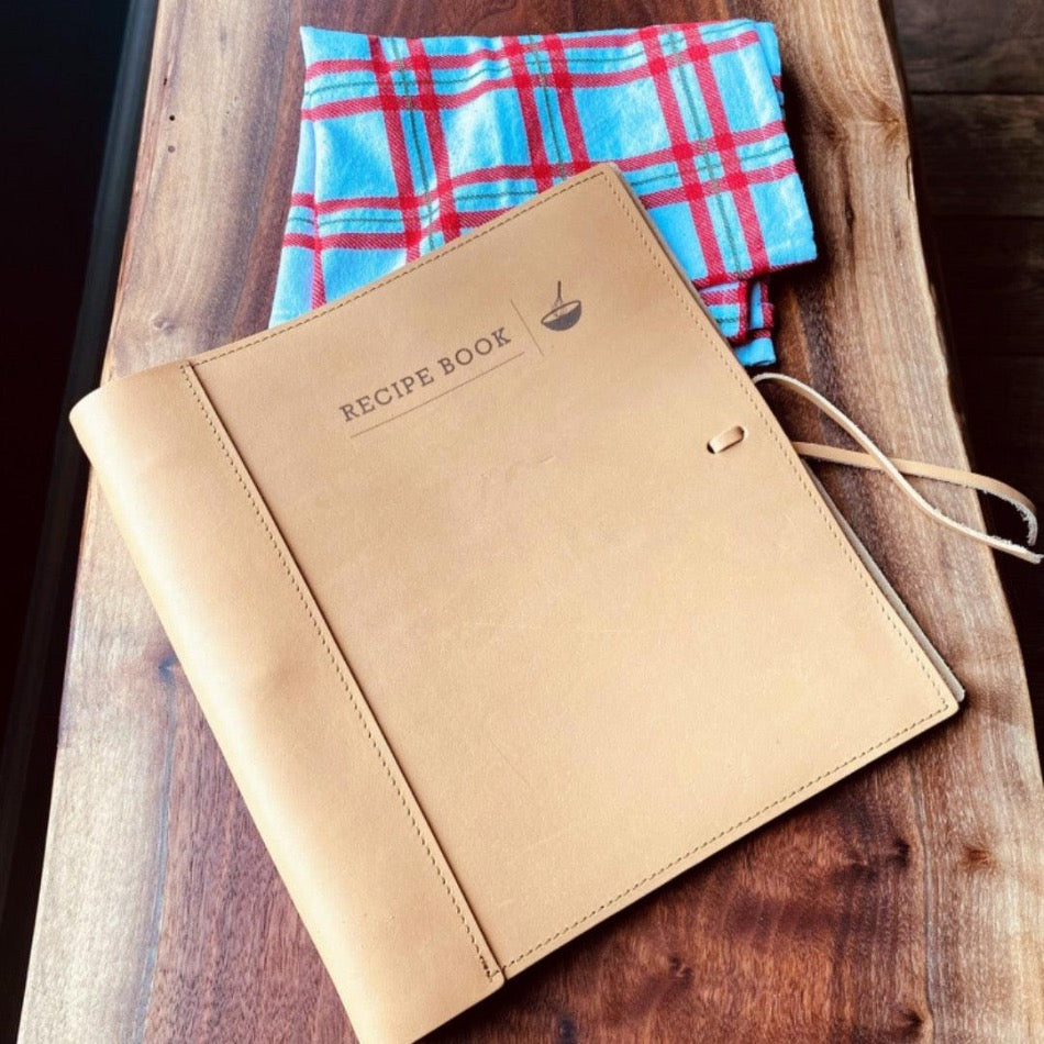
                  
                    Leather Recipe Binder  This Leather Recipe Binder is a classic way to store all your cherished recipes! Choose from two sizes and get your collection going with plastic page protectors, plus blank 4x6 recipe cards. Keep adding to it for years to come and your recipe book will only get better! It sounds tasty!
                  
                