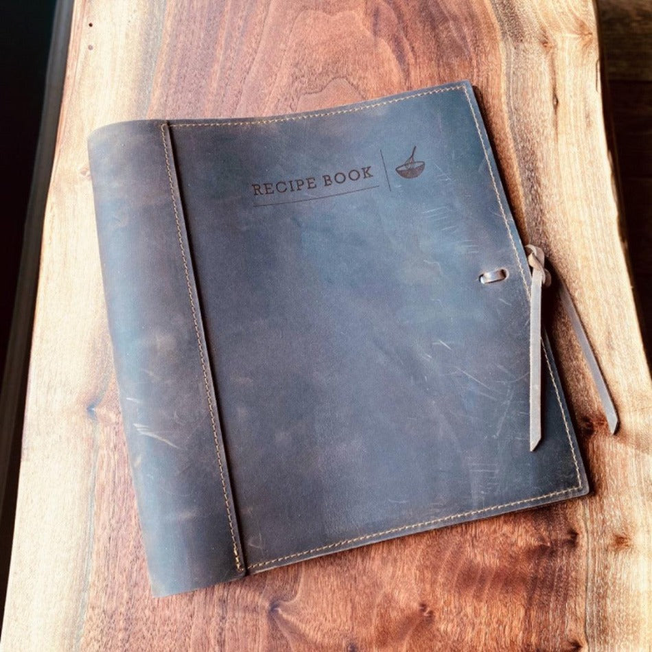 
                  
                    Leather Recipe Binder  This Leather Recipe Binder is a classic way to store all your cherished recipes! Choose from two sizes and get your collection going with plastic page protectors, plus blank 4x6 recipe cards. Keep adding to it for years to come and your recipe book will only get better! It sounds tasty!
                  
                