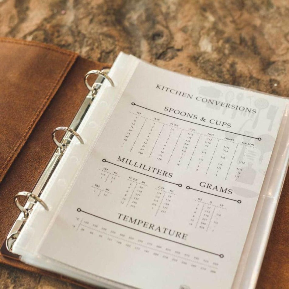 
                  
                    Leather Recipe Binder  This Leather Recipe Binder is a classic way to store all your cherished recipes! Choose from two sizes and get your collection going with plastic page protectors, plus blank 4x6 recipe cards. Keep adding to it for years to come and your recipe book will only get better! It sounds tasty!
                  
                