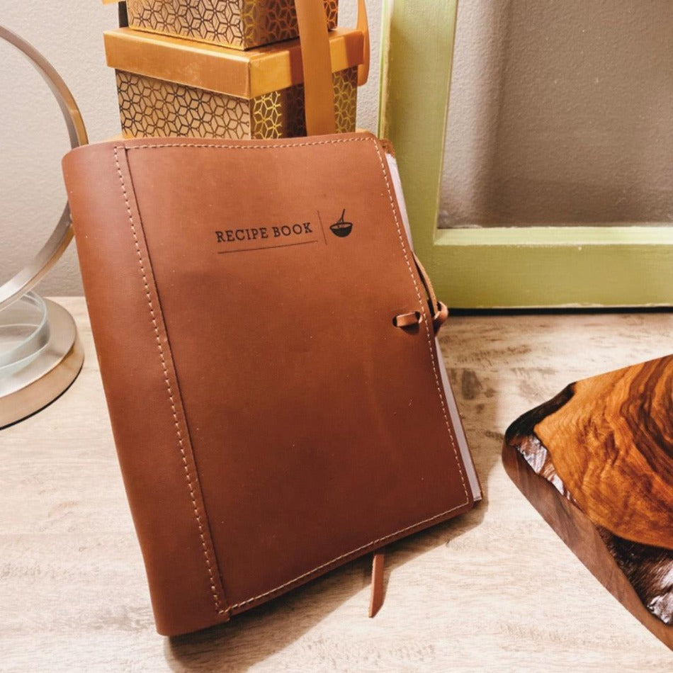 
                  
                    Leather Recipe Binder  This Leather Recipe Binder is a classic way to store all your cherished recipes! Choose from two sizes and get your collection going with plastic page protectors, plus blank 4x6 recipe cards. Keep adding to it for years to come and your recipe book will only get better! It sounds tasty!
                  
                