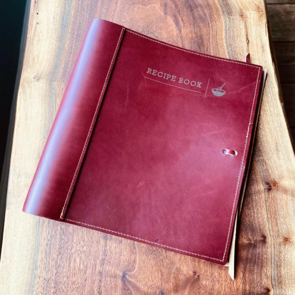 
                  
                    Leather Recipe Binder  This Leather Recipe Binder is a classic way to store all your cherished recipes! Choose from two sizes and get your collection going with plastic page protectors, plus blank 4x6 recipe cards. Keep adding to it for years to come and your recipe book will only get better! It sounds tasty!
                  
                